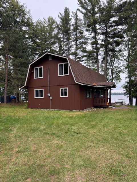 Lakeside cabin surrounded by trees